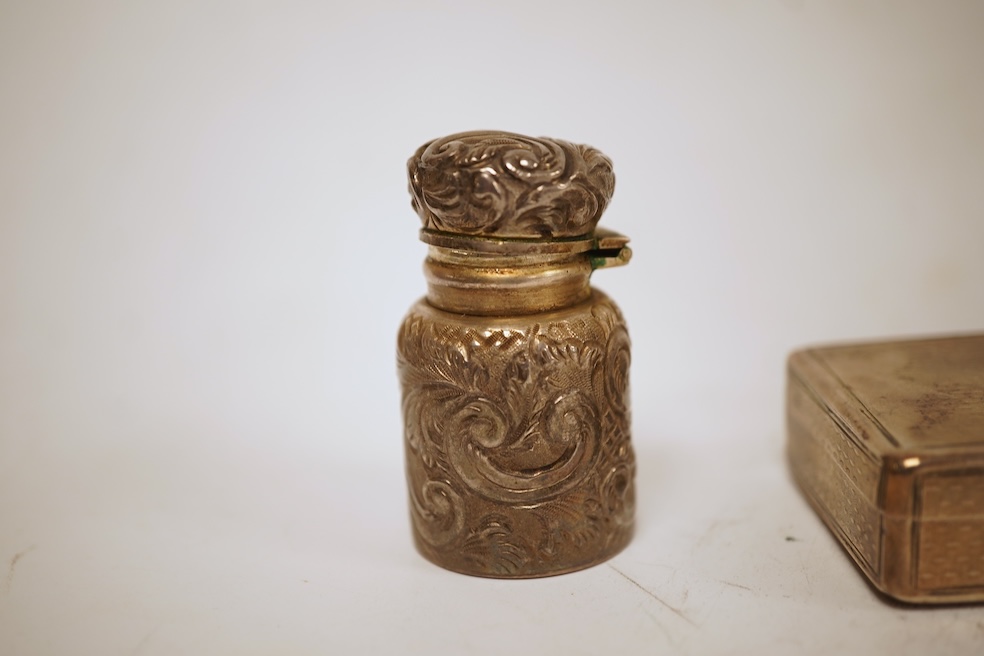 A Victorian engraved silver snuff box, Yapp & Woodward, Birmingham, 1899, 68mm, a small silver scent bottle and two silver-mounted glass scent bottles.